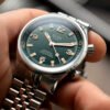 SOMBRERO 90-011 Green Linen Textured Dial 20 BAR automatic dive watch on hand close