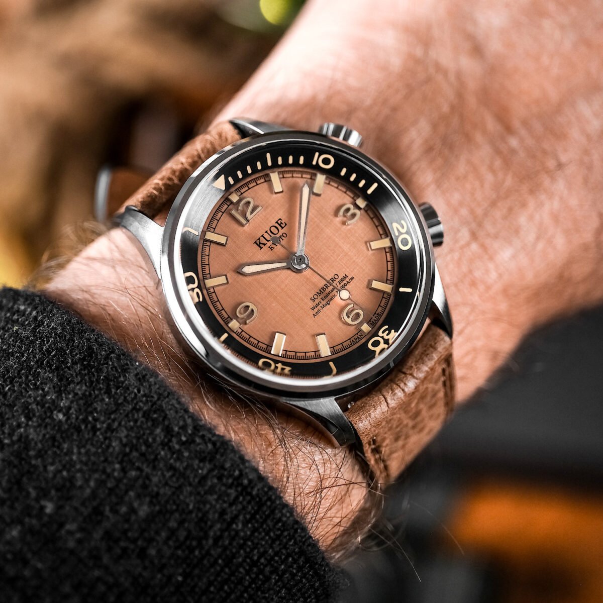 KUOE SOMBRERO 90-011 Salmon Pink linen textured dial Miyota 9039 20 BAR leather strap on wrist 2
